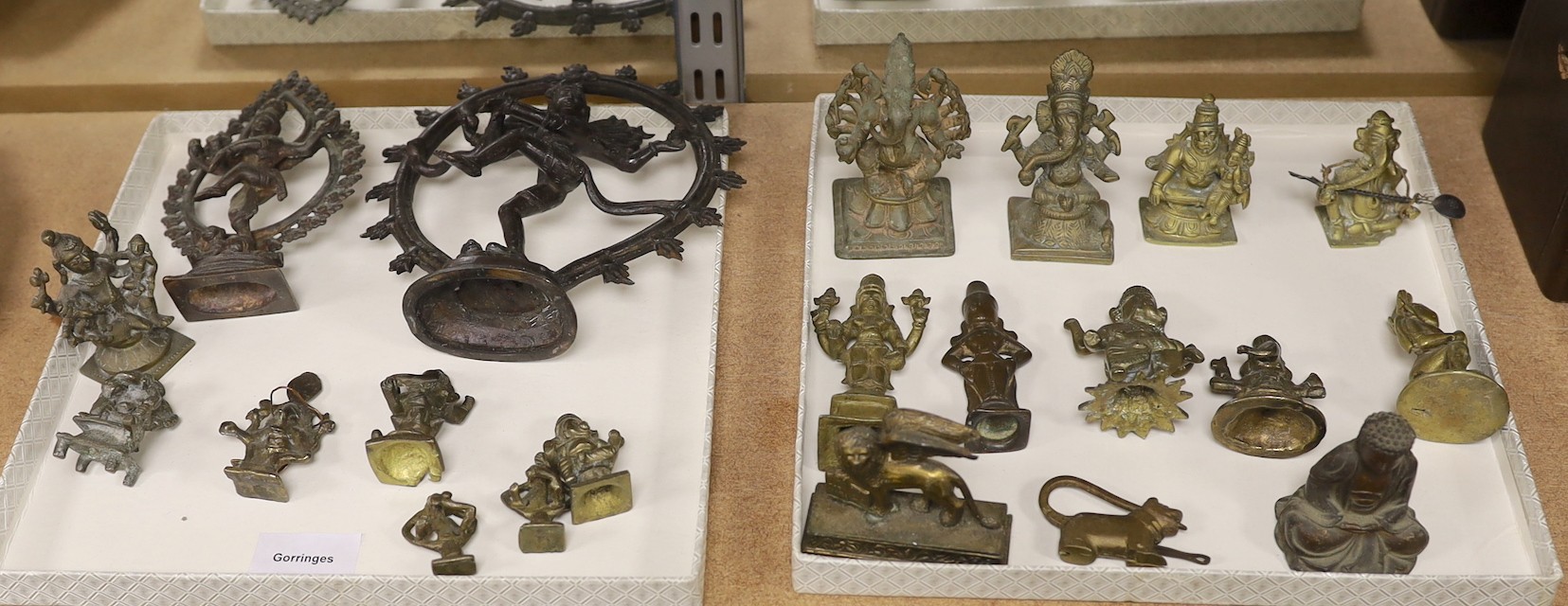 Assorted bronze and cast metal deities, largest 18 cms high